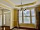 Bright living room with hardwood floors, transom windows, and stylish curtains at 1549 Lily Creek Dr, Cary, NC 27518