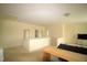 A spacious living room features a comfortable sofa and wooden desk at 1549 Lily Creek Dr, Cary, NC 27518