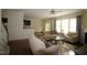 Open-concept living space featuring wood floors, comfortable seating, and seamless flow to the kitchen at 1549 Lily Creek Dr, Cary, NC 27518