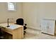 Bright home office with desk and a large window, creating a comfortable workspace at 1549 Lily Creek Dr, Cary, NC 27518