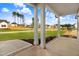 Covered back porch offering picturesque views of the lush backyard and the surrounding neighborhood at 157 Gumtop Dr, Zebulon, NC 27597