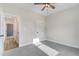 Spacious bedroom with carpet, ceiling fan, with view of entry hall and closet at 157 Gumtop Dr, Zebulon, NC 27597