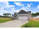 Lovely new construction home with an attached garage and driveway leading up to it at 157 Gumtop Dr, Zebulon, NC 27597
