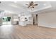Open-concept kitchen with white cabinets, a center island, modern stainless appliances, and pendant lighting at 157 Gumtop Dr, Zebulon, NC 27597