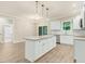 Spacious kitchen with an island, stainless steel appliances and a view to the back yard at 157 Gumtop Dr, Zebulon, NC 27597