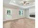 Cozy living room with wood floors, a fireplace, and access to a deck at 157 Gumtop Dr, Zebulon, NC 27597
