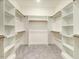 Walk-in closet with built-in shelving and wooden rods at 157 Gumtop Dr, Zebulon, NC 27597