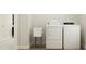 Functional laundry room with a washer, dryer, and utility sink at 1601 Goldfinch Perch Ln, Knightdale, NC 27545