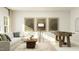 Inviting living room with a comfortable sectional sofa, stylish decor, and a foosball table at 1601 Goldfinch Perch Ln, Knightdale, NC 27545
