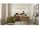 Charming home office features a wooden desk, stylish chairs, and neutral decor at 1601 Goldfinch Perch Ln, Knightdale, NC 27545