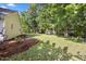 Large and well maintained yard with a shed in the backyard at 205 Hornholly Way, Holly Springs, NC 27540