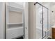 Bathroom has a modern walk-in shower, and a closet for storage at 205 Hornholly Way, Holly Springs, NC 27540