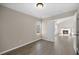 Open bedroom with wood-look floors and lots of natural light at 205 Hornholly Way, Holly Springs, NC 27540