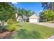 Charming one-story home with a well-manicured lawn and traditional architectural details at 205 Hornholly Way, Holly Springs, NC 27540