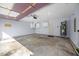 Attached garage interior with water heater, built in shelves, and storage at 205 Hornholly Way, Holly Springs, NC 27540