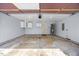 Spacious garage with overhead storage cabinets, water heater, and ample room for parking and projects at 205 Hornholly Way, Holly Springs, NC 27540