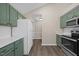 Bright kitchen with stainless steel appliances and ample cabinet space at 205 Hornholly Way, Holly Springs, NC 27540