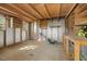 Inside the storage shed with work benches, shelving and plywood flooring at 205 Hornholly Way, Holly Springs, NC 27540