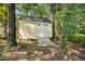 Storage shed in the backyard with double doors, ramp, and windows at 205 Hornholly Way, Holly Springs, NC 27540