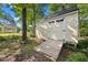 Storage shed with double doors, ramp, and in the backyard at 205 Hornholly Way, Holly Springs, NC 27540