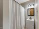 Bathroom featuring a white vanity, framed mirror, and a shower with a white curtain at 2092 Winwood Farm Rd, Creedmoor, NC 27522