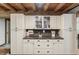 This kitchen features white cabinets, dark countertops, neutral backsplash, and stainless steel appliances at 2092 Winwood Farm Rd, Creedmoor, NC 27522