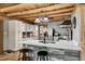 Charming kitchen features white cabinets, stainless steel appliances, an island, and a stylish backsplash at 2092 Winwood Farm Rd, Creedmoor, NC 27522