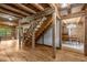 This living room features wood accents on the ceiling, walls and floor, with a unique wooden staircase at 2092 Winwood Farm Rd, Creedmoor, NC 27522