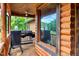This porch features a grill and smoker to enjoy outdoor cooking, and lots of nature to enjoy at 2092 Winwood Farm Rd, Creedmoor, NC 27522