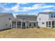 This home has a gray exterior, a screened porch, and a lawn at 2100 Curry Meadow Way, Durham, NC 27703
