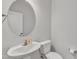 Bright powder room with white vanity, round mirror, and neutral walls at 2100 Curry Meadow Way, Durham, NC 27703