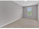 Neutral bedroom with window at 2100 Curry Meadow Way, Durham, NC 27703