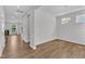 Open dining room with wood floors and access to other rooms at 2100 Curry Meadow Way, Durham, NC 27703