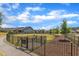 Fenced dog park provides a safe and fun space for pets to play and socialize within the community at 2100 Curry Meadow Way, Durham, NC 27703