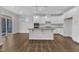 Modern kitchen featuring white cabinets, granite counters, and an island at 2100 Curry Meadow Way, Durham, NC 27703