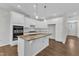 Beautiful kitchen features an island, stainless appliances and granite counters at 2100 Curry Meadow Way, Durham, NC 27703