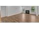 Spacious living area featuring hardwood floors and a cozy fireplace at 2100 Curry Meadow Way, Durham, NC 27703