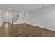 Open-concept living room showcasing hardwood floors and staircase at 2100 Curry Meadow Way, Durham, NC 27703