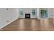 Inviting living room boasting hardwood floors and a modern fireplace at 2100 Curry Meadow Way, Durham, NC 27703