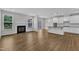 Hardwood floors complement the living room with a fireplace and open layout at 2100 Curry Meadow Way, Durham, NC 27703