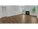 Open living room offers hardwood floors and a fireplace with lots of light at 2100 Curry Meadow Way, Durham, NC 27703