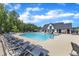 Inviting community pool with ample seating and a clubhouse, perfect for relaxation and social gatherings at 2100 Curry Meadow Way, Durham, NC 27703