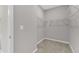 A well-organized walk-in closet with wire shelving for easy storage and access at 2100 Curry Meadow Way, Durham, NC 27703