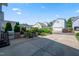 Spacious backyard patio with a built-in grill, outdoor seating, and lush landscaping at 2121 Karns Pl, Raleigh, NC 27614