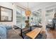 Charming breakfast nook with banquette seating, wood bench, and views to a sunroom at 2121 Karns Pl, Raleigh, NC 27614