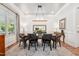 Formal dining room with elegant chandelier, table, chairs, and hardwood floors at 2121 Karns Pl, Raleigh, NC 27614