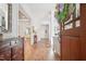 Bright and open foyer with hardwood floors, white trim, and a view into the living spaces at 2121 Karns Pl, Raleigh, NC 27614