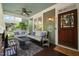 Cozy front porch with comfortable seating, a ceiling fan, and a stylish outdoor rug, perfect for relaxation at 2121 Karns Pl, Raleigh, NC 27614