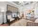 Cozy sunroom featuring stylish decor, comfortable seating, and bright natural light at 2121 Karns Pl, Raleigh, NC 27614