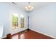 Bright dining area with hardwood floors and glass doors leading to the deck at 216 Climbing Ivy Ct, Cary, NC 27511